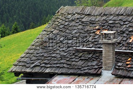 Roof Of Wooden Shingles And Stone Chimney
