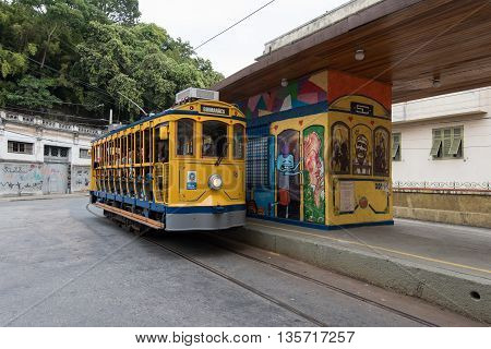 Rio de Janeiro, Brazil - June 18, 2016: New version of the classic yellow tram of Santa Teresa riding in the streets.