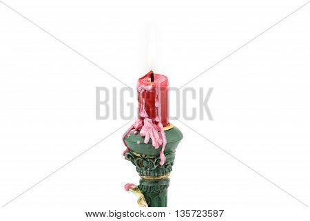 Bruning red aroma candle with wax on cupid holder isolated white background