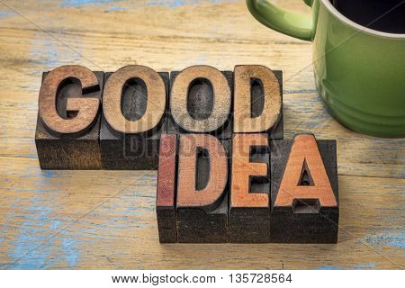 good idea word abstract in letterpress woodtype with a cup of coffee