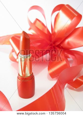 red lipstick and ribbon