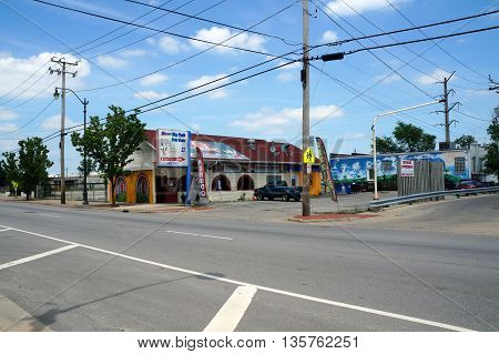 JOLIET, ILLINOIS / UNITED STATES - JUNE 3, 2015: Direct Thy Path Day Care II is directly behind the Doña Chelo Mexican restaurant in downtown Joliet.