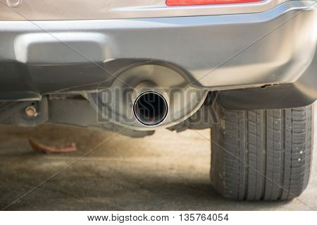 Exhaust pipe of a Brown car concern about environment