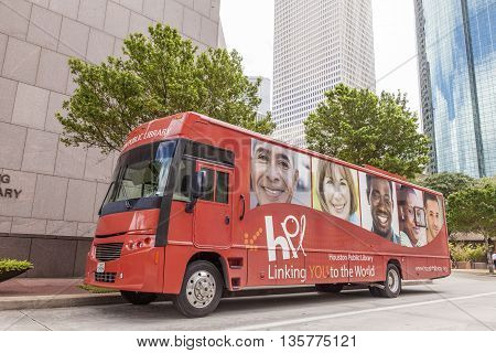 HOUSTON USA - APR 14: Red public library bus downtown in Houston. April 14 2016 in Houston Texas United States
