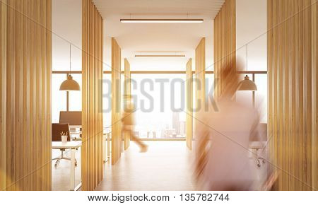 Blurry businesspeople walking in open office interior with wooden partitions concrete floor ceiling with lamps and New York city view.Toned image 3D Rendering