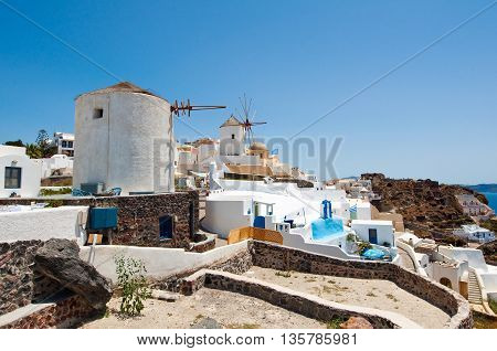 Oia windmills on the island of Santorini (Thira). Cyclades in Greece.