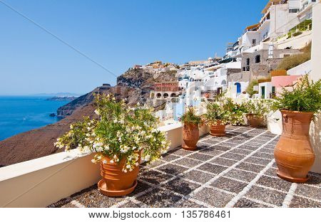Idyllic patio with flowers in Fira town on the island of Thera(Santorini) Greece.