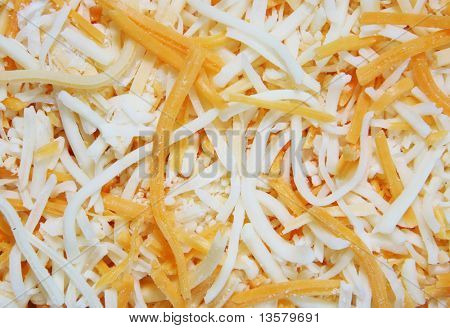 Baggrund af strimlet cheddar og monterey jack ost