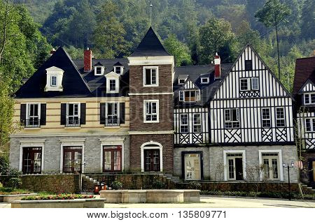 Bai Lu China - October 18 2012: Handsome French-inspired half-timber and stucco houses line a village square  *