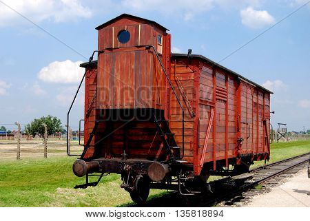 Auschwitz Poland - June 9 2010: One of the infamous transport box cars with no windows brought Jews and other victims from all over Europe to the infamous Birkenau concentration camp