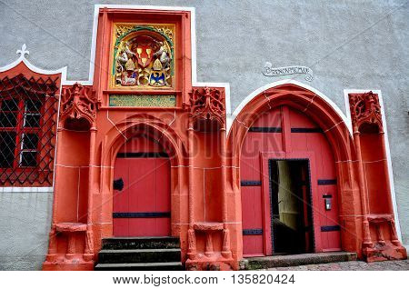 Meissen Germany - May 28 2013: Renaissance doorways painted in a bright coral colour on the Hochstift Meissen Haus