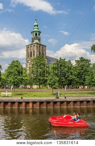 NORDHORN, GERMANY - JUNE 4, 2016: Pedal boat in a canal in Nordhorn, Germany