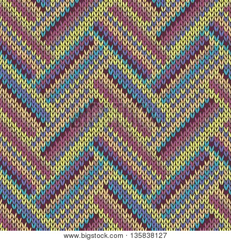 Seamless knitted pattern. Multicolored repeating tribal template