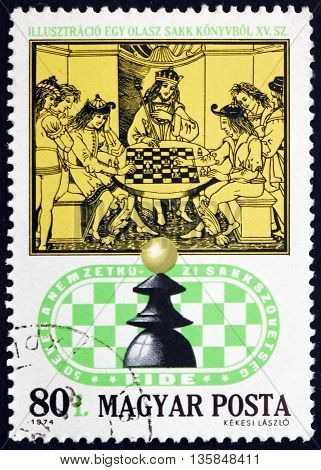 HUNGARY - CIRCA 1974: a stamp printed in Hungary shows Royal Chess Party 15th Century Italian Chess Book circa 1974