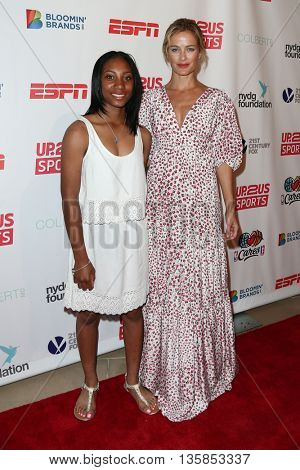 NEW YORK, NY-JUNE 3: Anderson Monarchs little league pitcher Mo'ne Davis (L) and model Carolyn Murphy attends the 2015 Up2Us Sports Gala at IAC Building on June 3, 2015 in New York City.