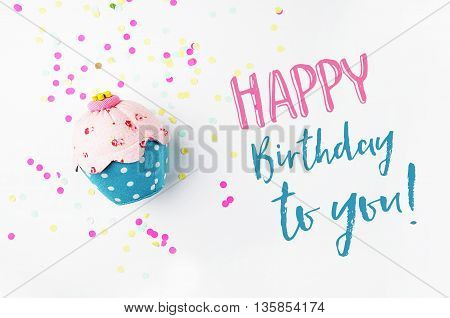 White background with party accessories. Invitation mockup. Confetti and muffins. cake. Happy birtday