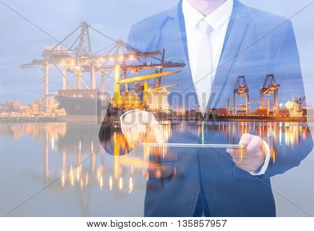Double Exposure Of Businessman Hand Hold Tablet