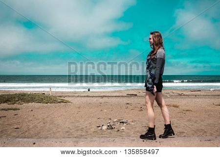 Pretty Girl Walking In Front Of The Beach In California