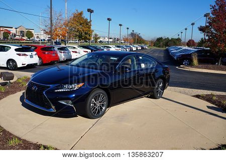 NAPERVILLE, ILLINOIS / UNITED STATES - NOVEMBER 3, 2015: A blue luxury sedan is on display on the lot at Lexus of Naperville.