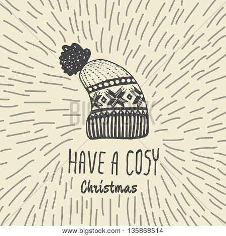 Christmas vintage card with with hand drawn knitted winter hat and text 'Have a Cosy Christmas'. Vector hand drawn illustration on beige background.