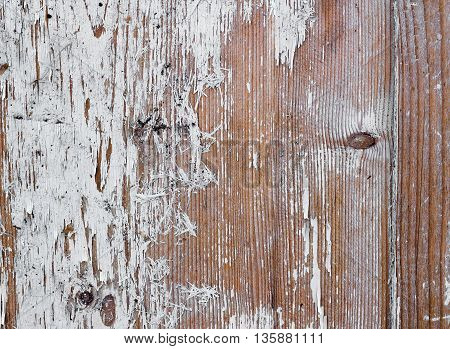 Wooden surface with traces of old white paint