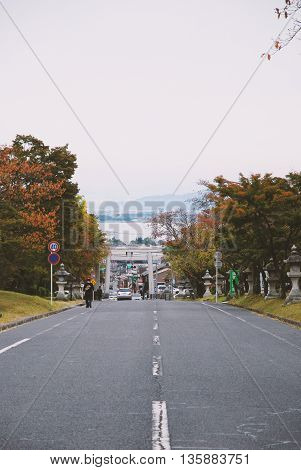 A peaceful street to Biwa lake, Otsu, Japan. Autumn season with filter color.