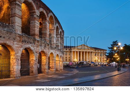 Verona Italy - May 07 2016: View of the Verona Arena against the backdrop of the Barbieri Palace evening time