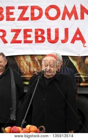 CRACOW POLAND - DECEMBER 20 2015: Cardinal Stanislaw Dziwisz during Christmas Eve for poor and homeless on the Central Market in Cracow.