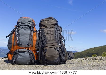 Camping with backpacks in the mountains with views of the mounta