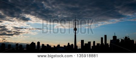 VIEW OF TORONTO SKYLINE IN SILHOUETTE DURING A FANTASTIC SUNSET