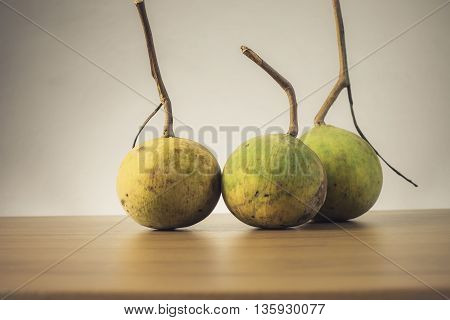 Santol fruit on wooden table - Still life