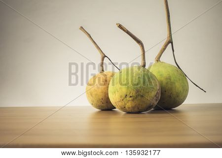 Santol fruit on wooden table - Still life