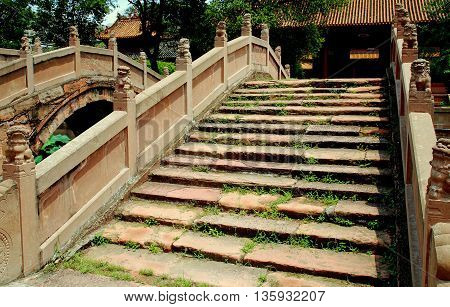Deyang China - July 6 2007: Lions balustrades decorate the Pan bridges at the Deyang Confucian Temple