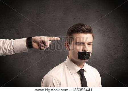 Caucasian business hand pointing at subordinate male employe