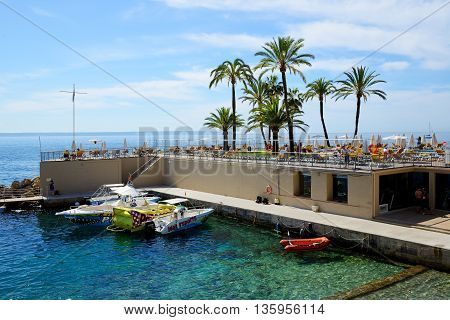 MALLORCA SPAIN - MAY 29: The tourists enjoiying their vacation on the beach on May 29 2015 in Mallorca Spain. Up to 60 mln tourists is expected to visit Spain in year 2015.