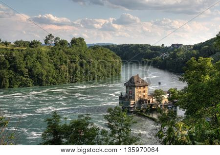 Woerth Castle, a customs house in history, today a restaurant at the Rhine Falls, Switzerland (HDR version)