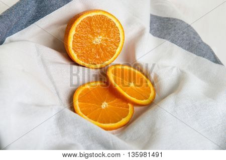 Juicy half of orange and orange slices