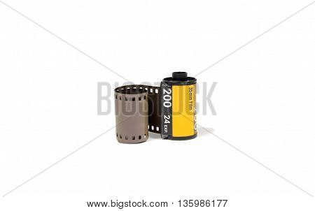 35 mm. film in the cassette on white background.
