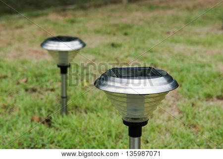 Solar Light in the grass. Clean energy is popular. For Earth, Superfund