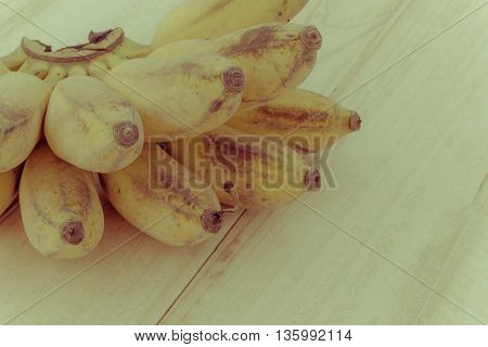 Pisang Awak banana Kluai Nam Wa Cultivate banana on wooden background copyspace vintage retro style.