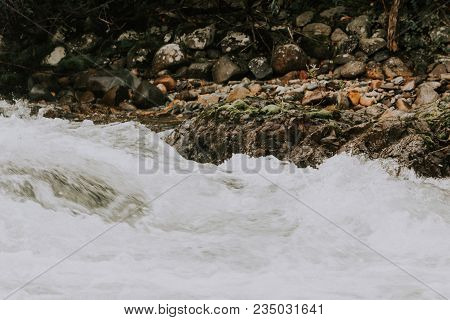 A Powerful Stream Of Mountain River. The Fast Current Of Water.