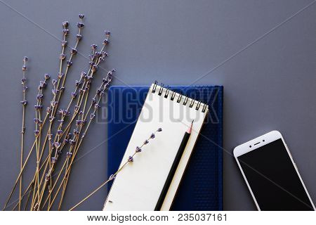 Designer Working Space Flatlay With Blue Leather Diary And Notepad, Black Pencil, Smartphone Mock Up