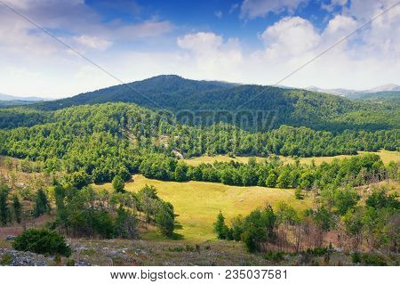 Beautiful Mountain Landscape Where Sunlight And Shadows From The Clouds Fall On Valley. Dinaric Alps