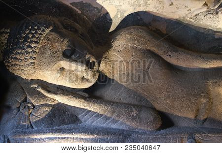 Ancient Stone Relief With Lying Buddha In Ajanta Caves, India. The Ajanta Caves In Maharashtra State