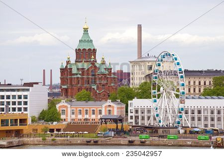 Helsinki, Finland - June 11, 2017: Cathedral Of The Assumption Of The Blessed Virgin And A Ferris Wh