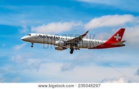 AIRPORT FRANKFURT,GERMANY: JUNE 23, 2017: Fokker 100 Helvetic Airways is a Swiss airline headquartered in Kloten with its fleet stationed at Zurich Airport