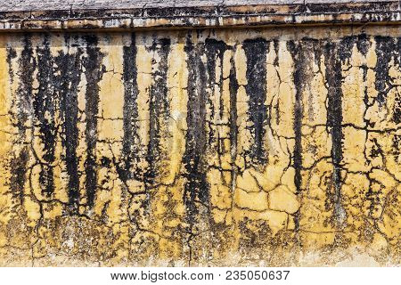 Texture Of An Old Wall. It Is Covered With Cracks And Fungal Spots. Amer Fort. Grunge