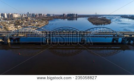 Aerial View Of The City, Ukraine. Dnieper River With Bridges. Darnitskiy Bridge. Combined Railway An