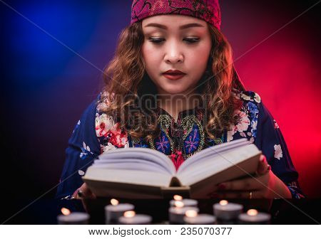 Female Seer Teller Doing Psychic Reading Book