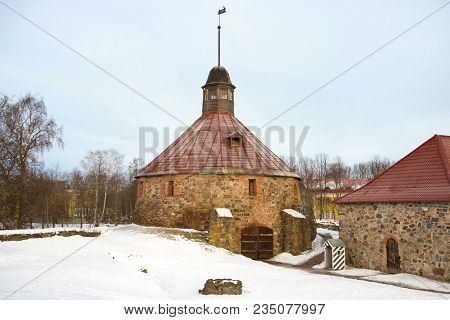 Ancient Round Tower Close Up In The Cloudy February Morning. Korela Fortress. Priozersk, Russia